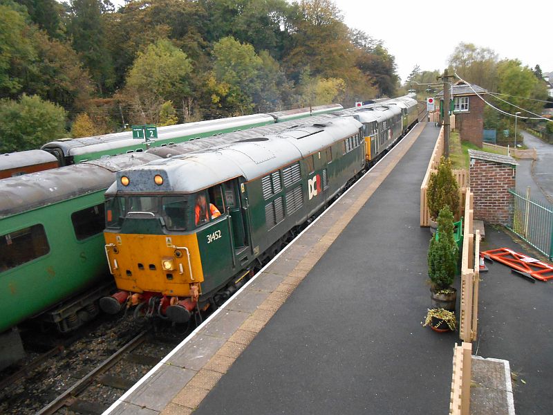 47701 Waverley departs a busy-looking Okehampton station behind 31452 and 31601