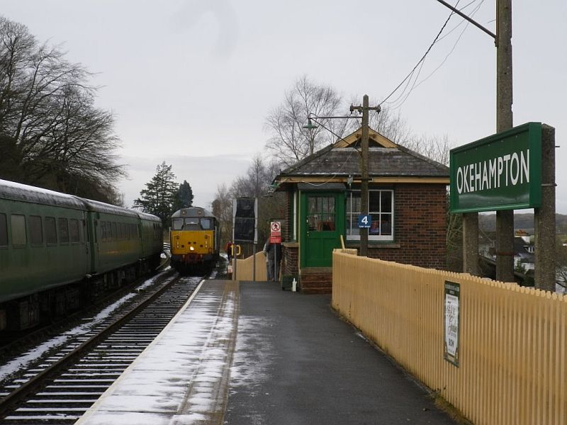 31601 preparing to depart Okehampton with the Polar Express traction in tow.